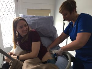 Nurse Lauren performing coolsculpting operation on patient